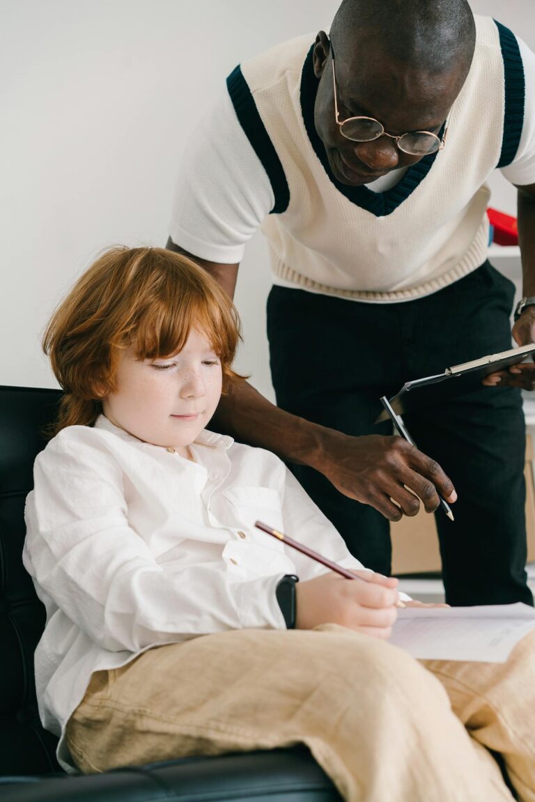 A tutor helps a child with homework during a learning session, fostering education development.